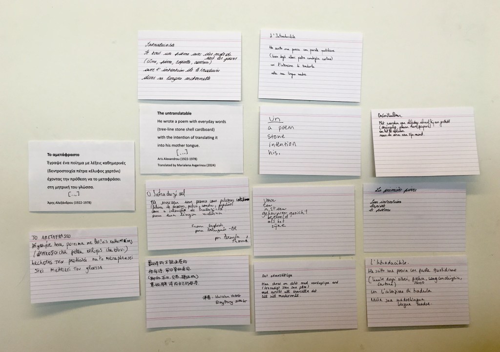 post-its against wall with black ink writing of a few lines in different languages